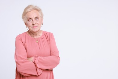 Photo of Portrait of senior woman on white background. Space for text