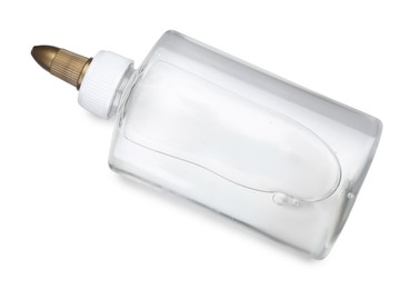 Photo of Bottle of transparent glue isolated on white, top view