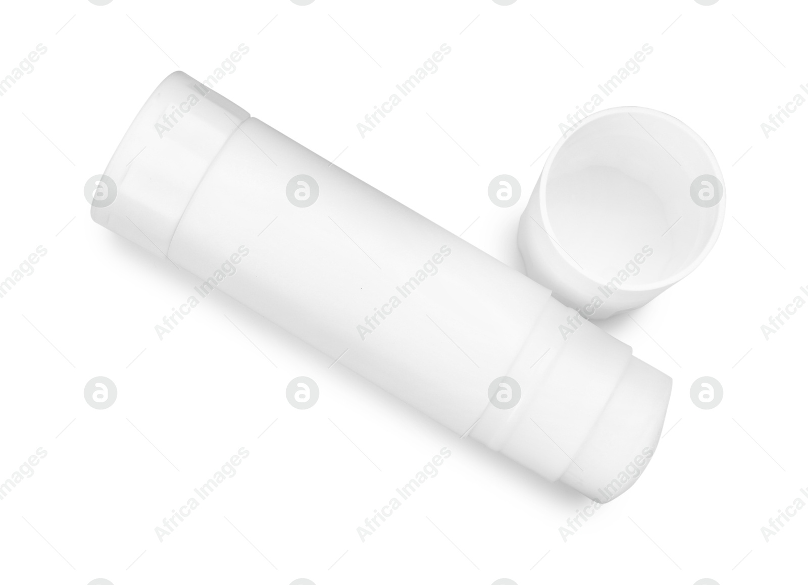 Photo of One glue stick and cap isolated on white, top view