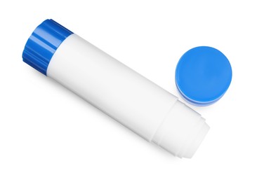 Photo of One glue stick and cap isolated on white, top view