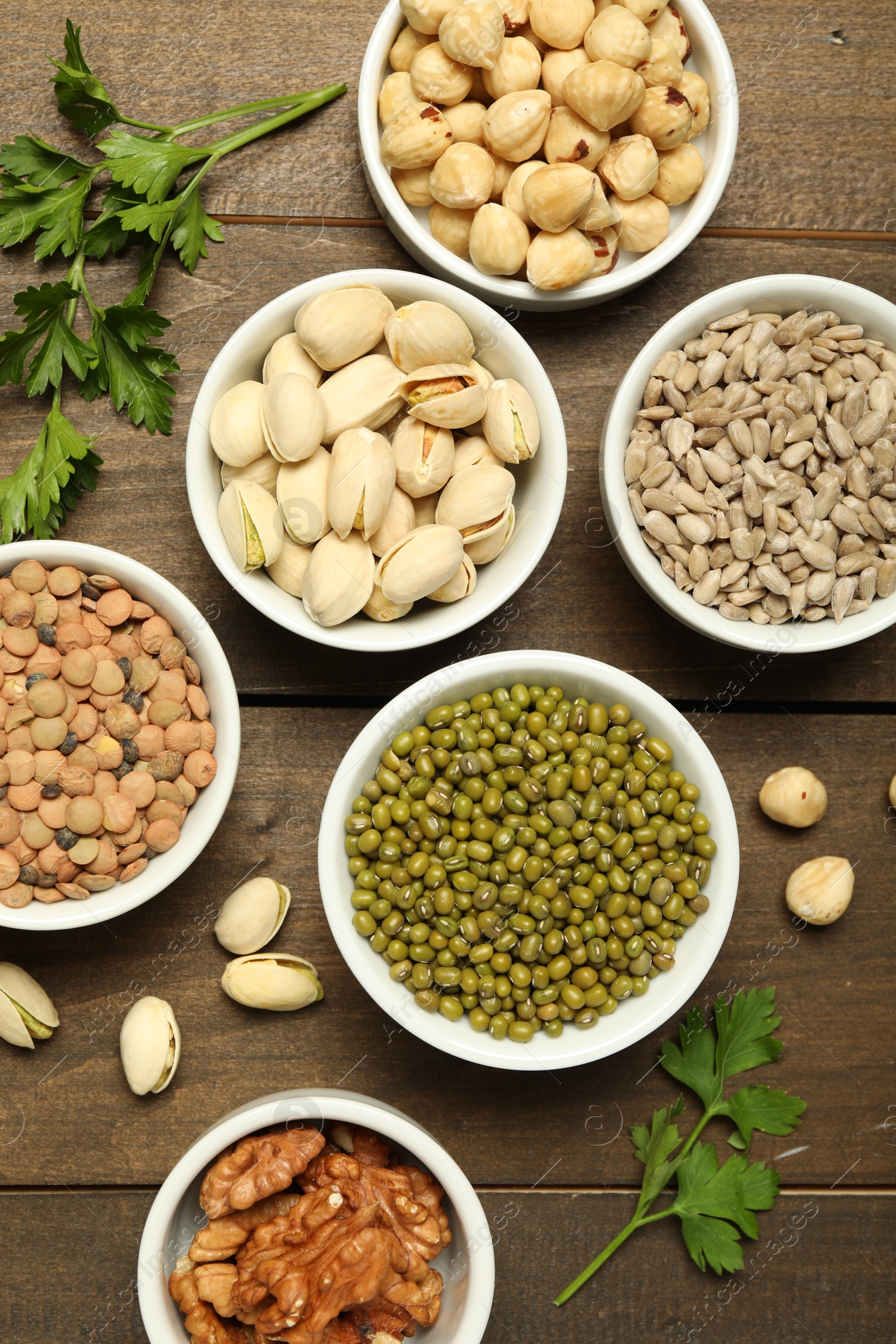 Photo of Superfood. Different healthy food products on wooden table, flat lay