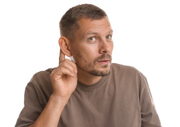 Photo of Man showing hand to ear gesture on white background