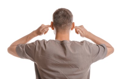 Photo of Man covering his ears with fingers on white background, back view