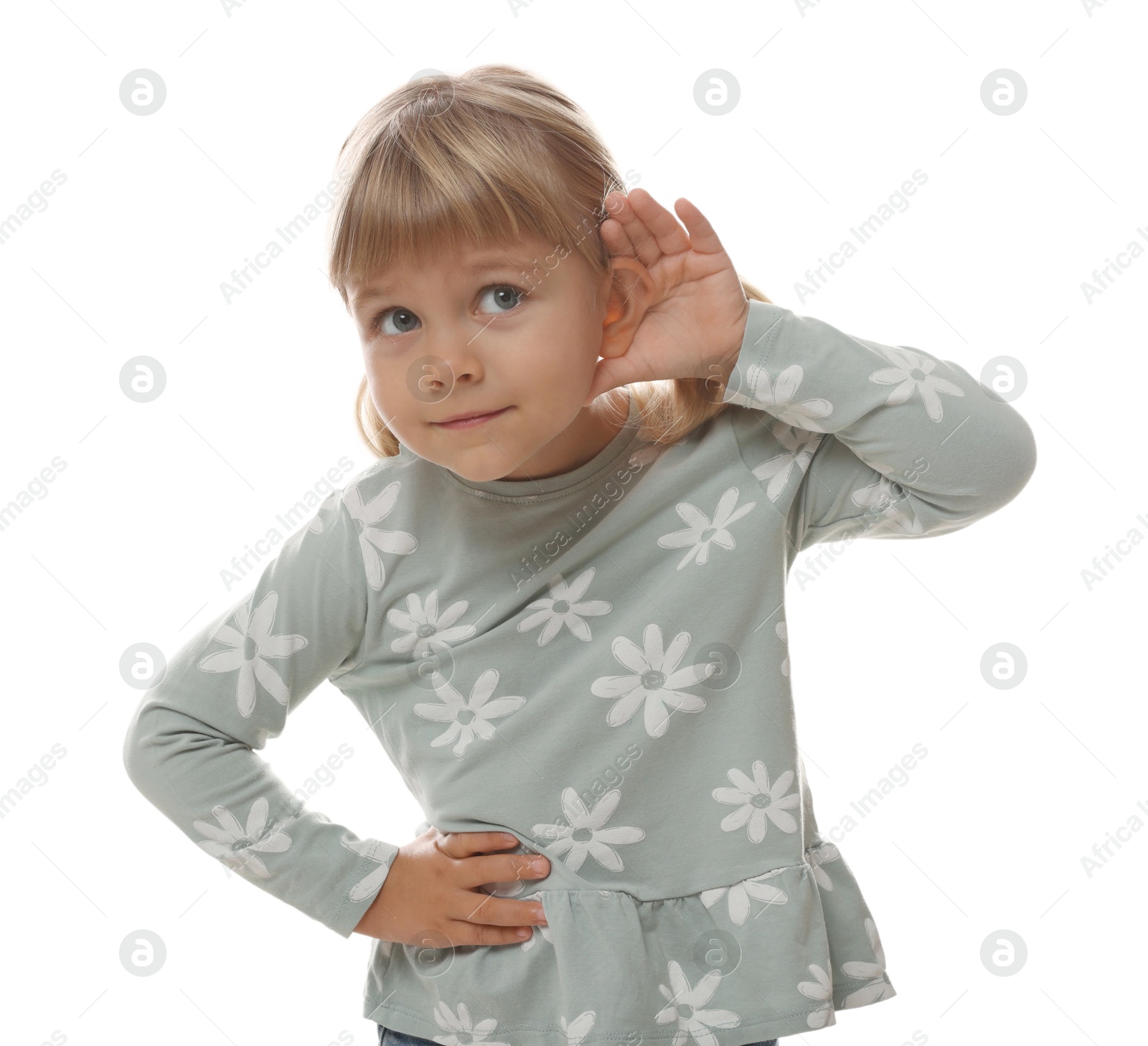 Photo of Little girl showing hand to ear gesture on white background