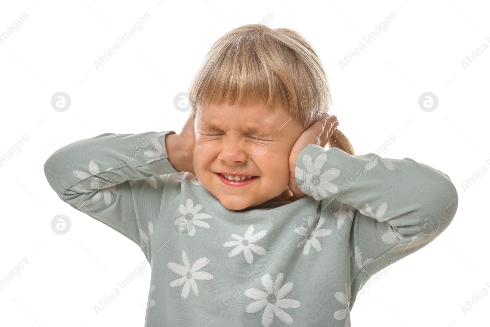 Photo of Little girl covering her ears on white background