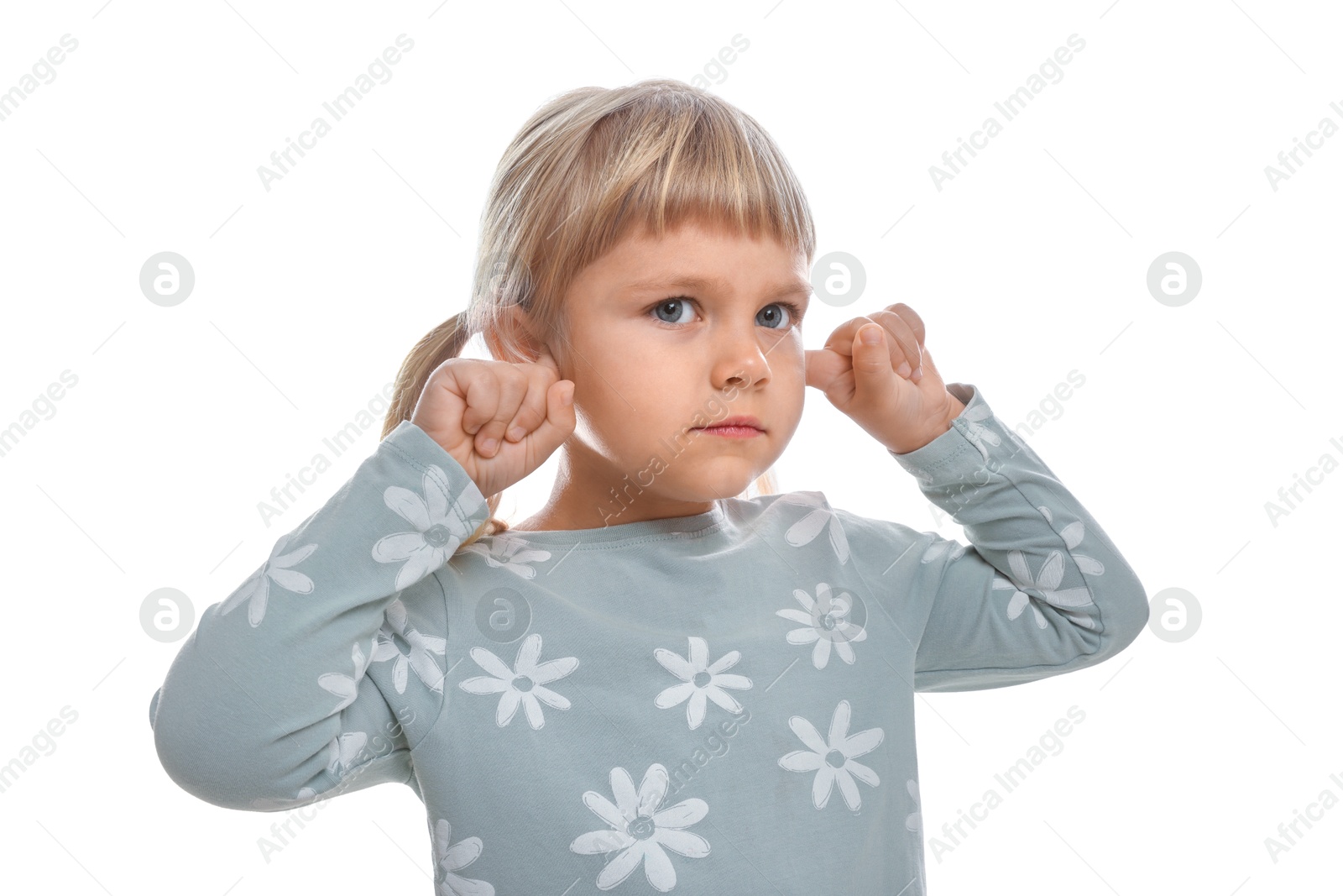 Photo of Little girl covering her ears with fingers on white background