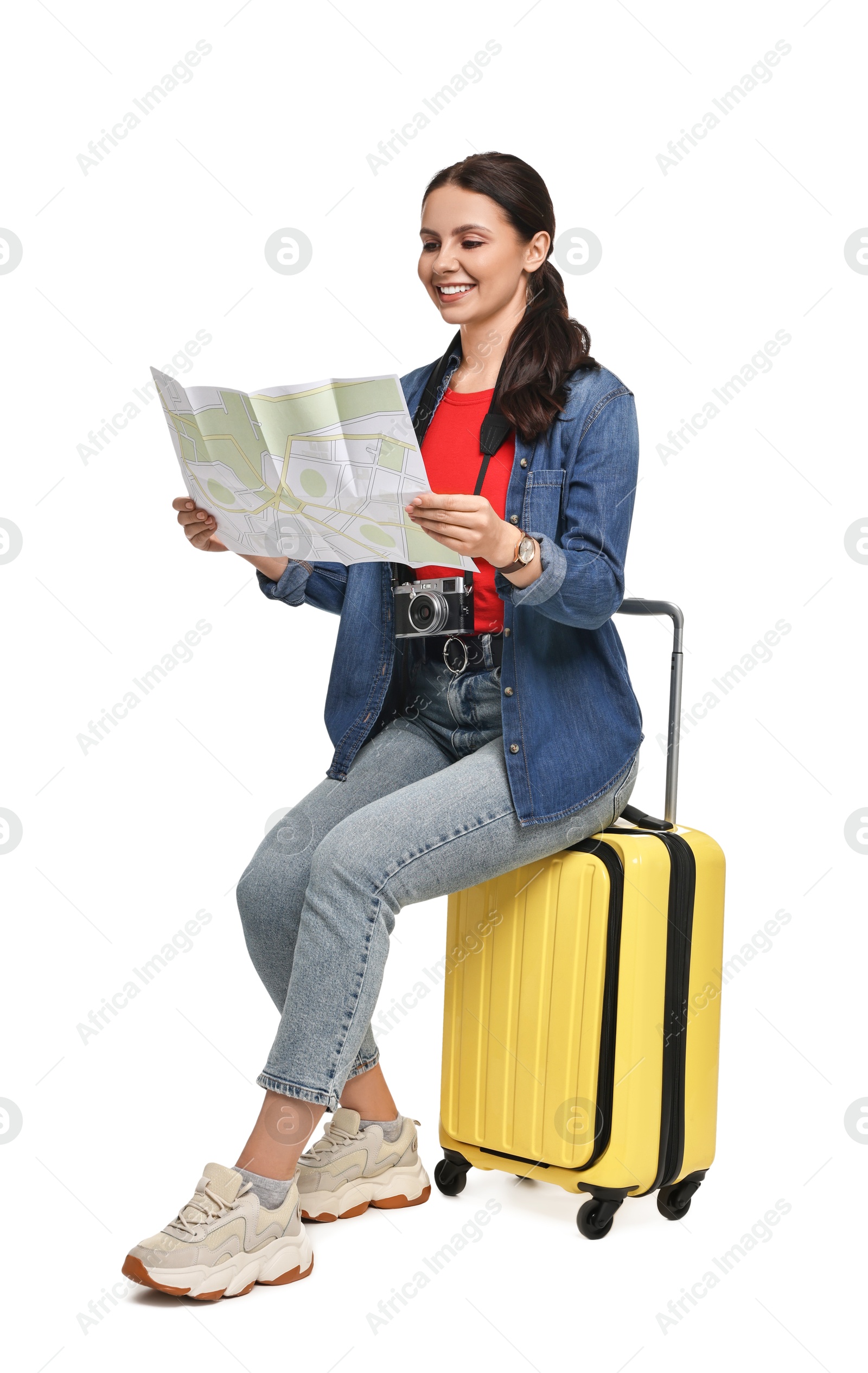 Photo of Young tourist with suitcase on white background