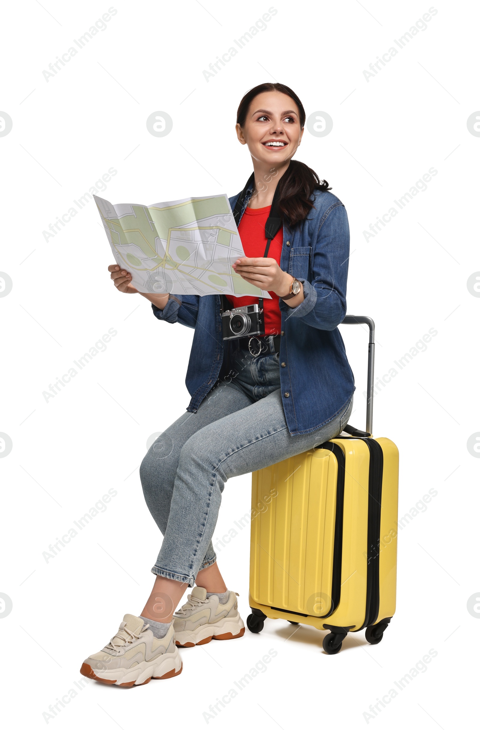 Photo of Young tourist with suitcase on white background