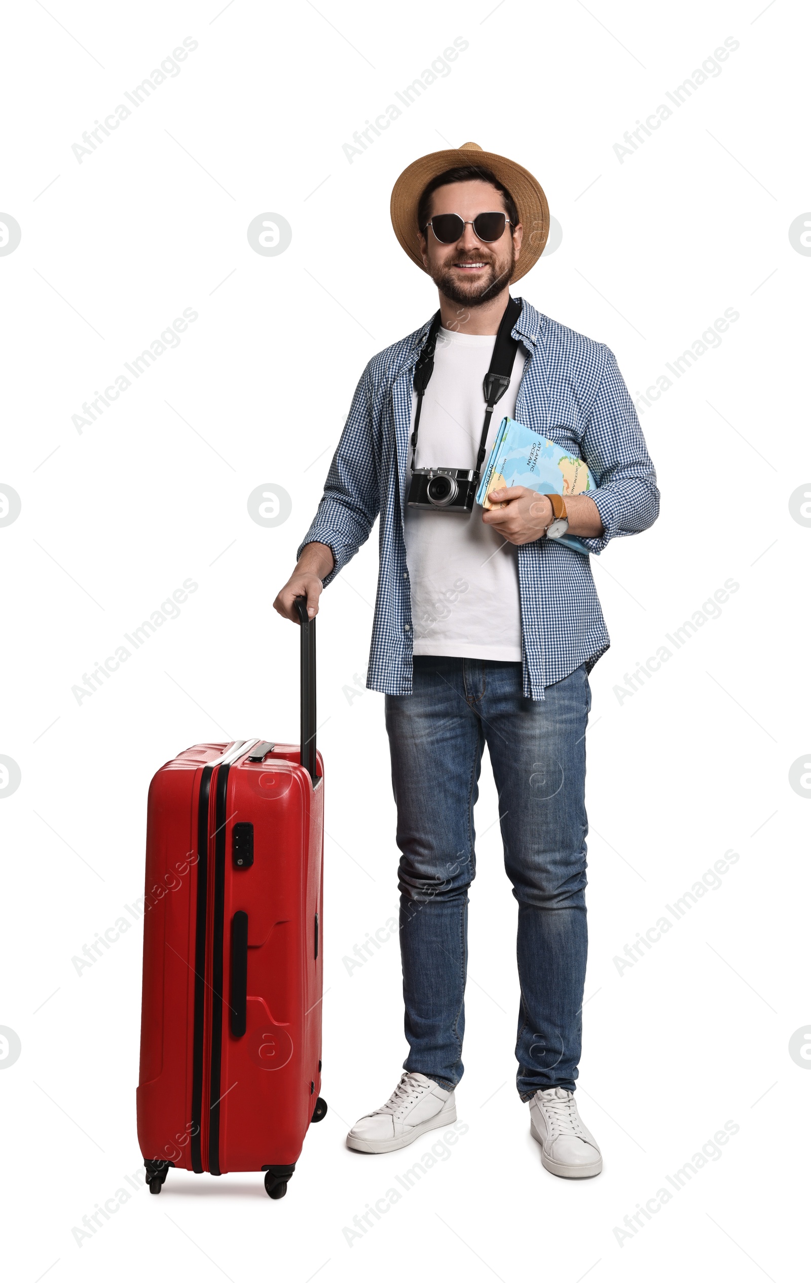 Photo of Happy tourist in hat with camera, map and suitcase on white background