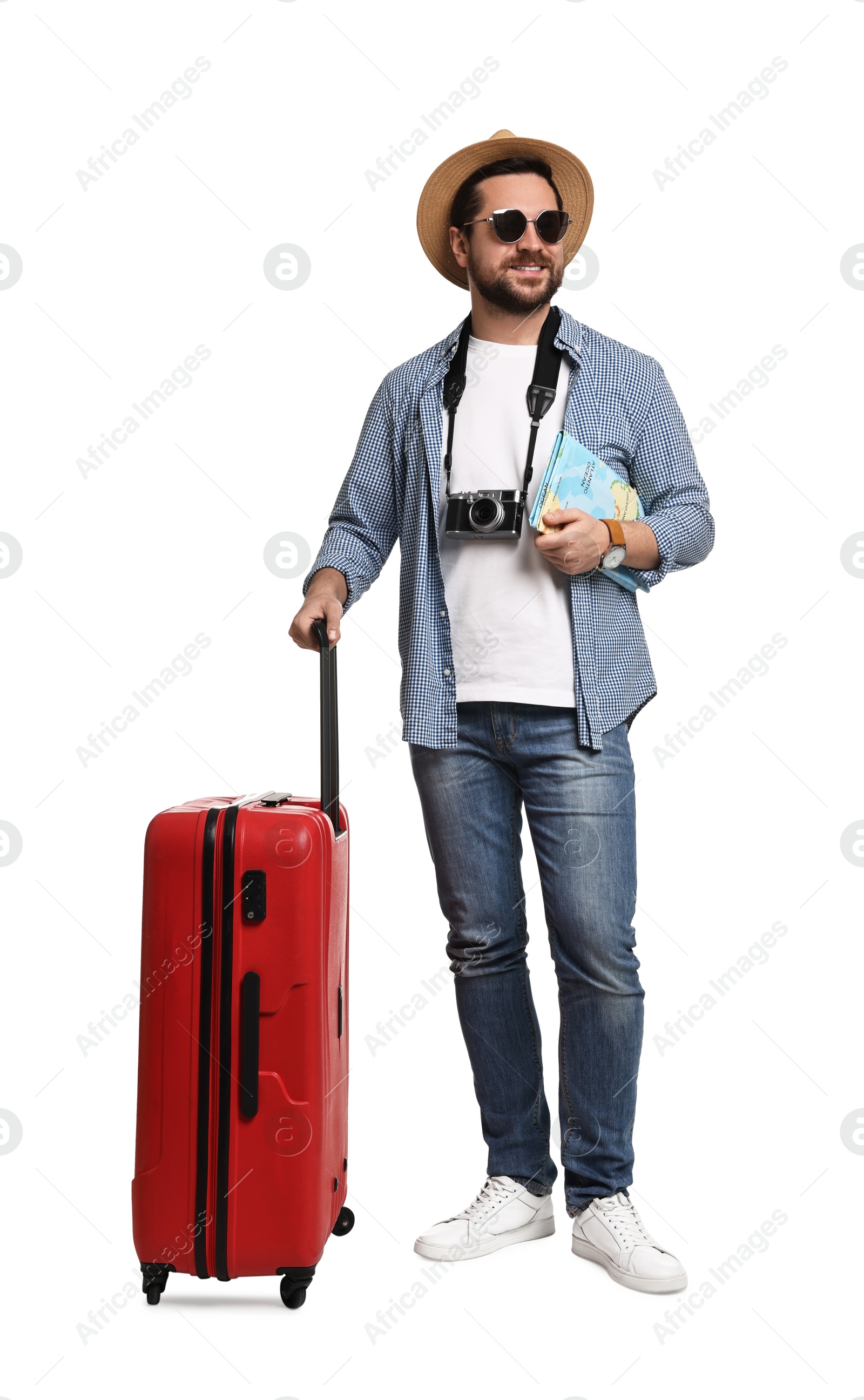 Photo of Happy tourist in hat with camera, map and suitcase on white background