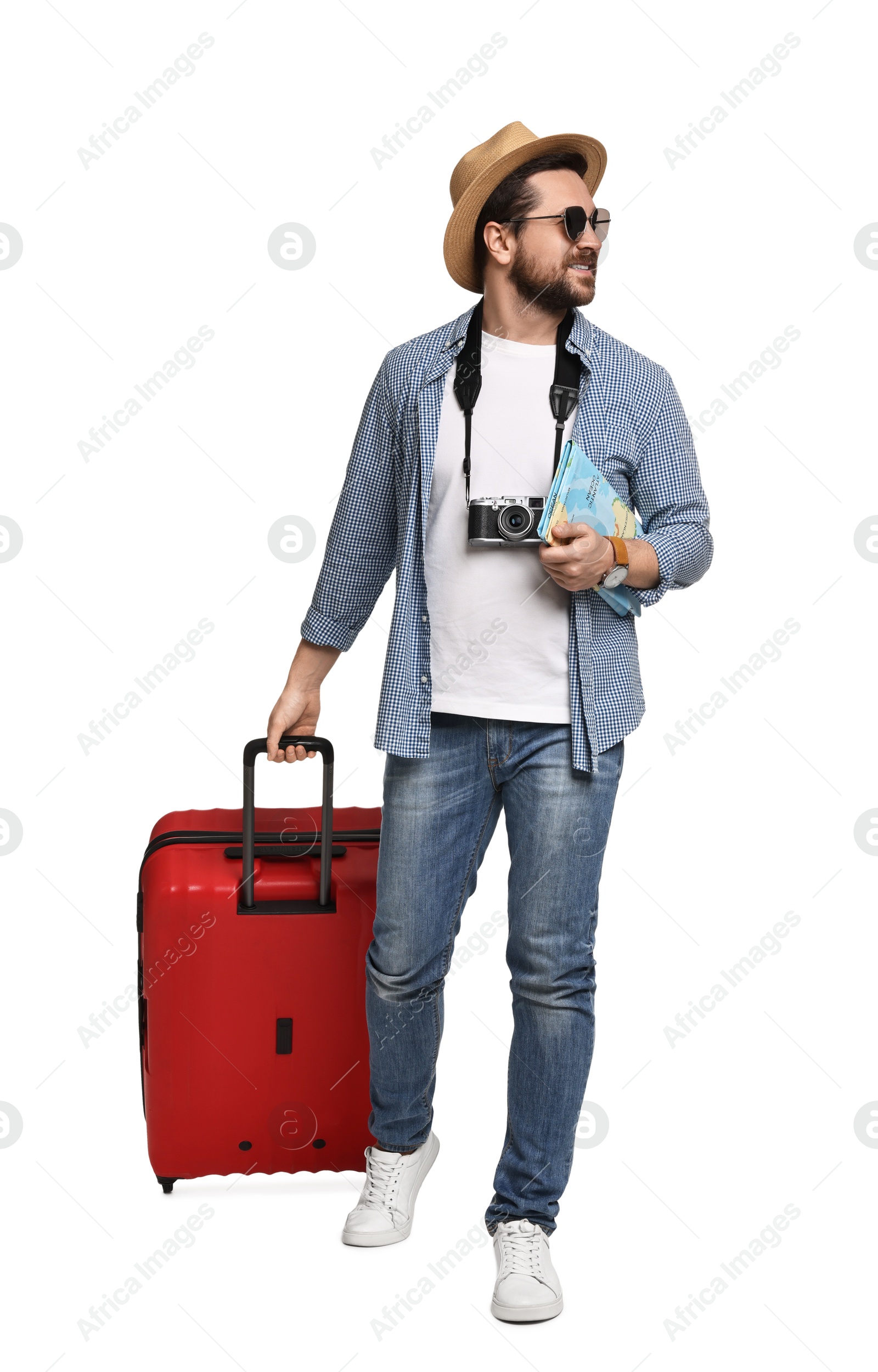 Photo of Happy tourist in hat with camera, map and suitcase on white background