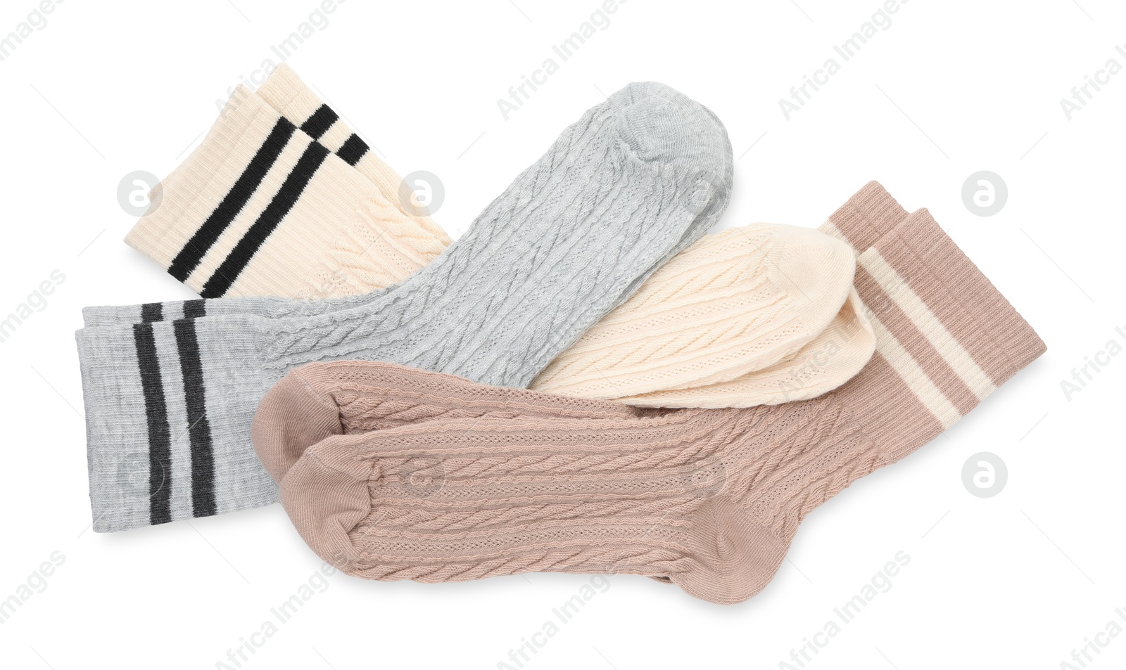 Photo of Different soft socks isolated on white, top view