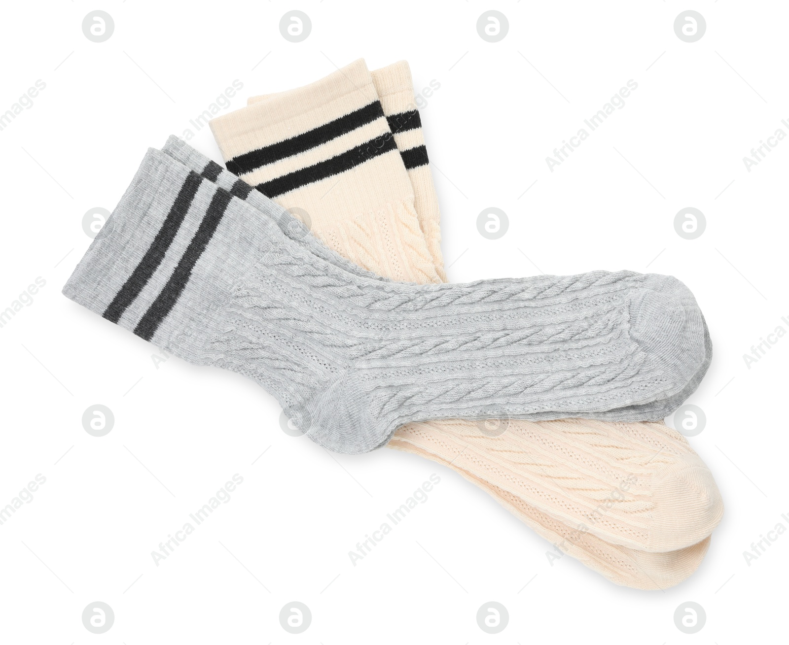 Photo of Different soft socks isolated on white, top view