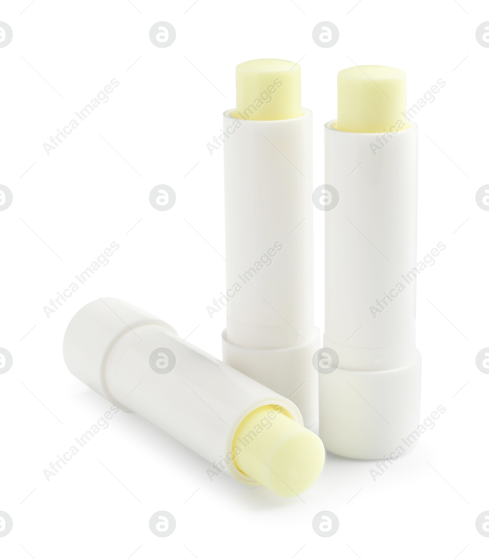 Photo of Lip balms isolated on white. Cosmetic product