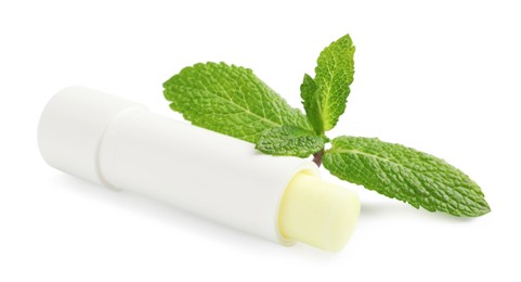 Photo of Mint lip balm and green leaves isolated on white. Cosmetic product