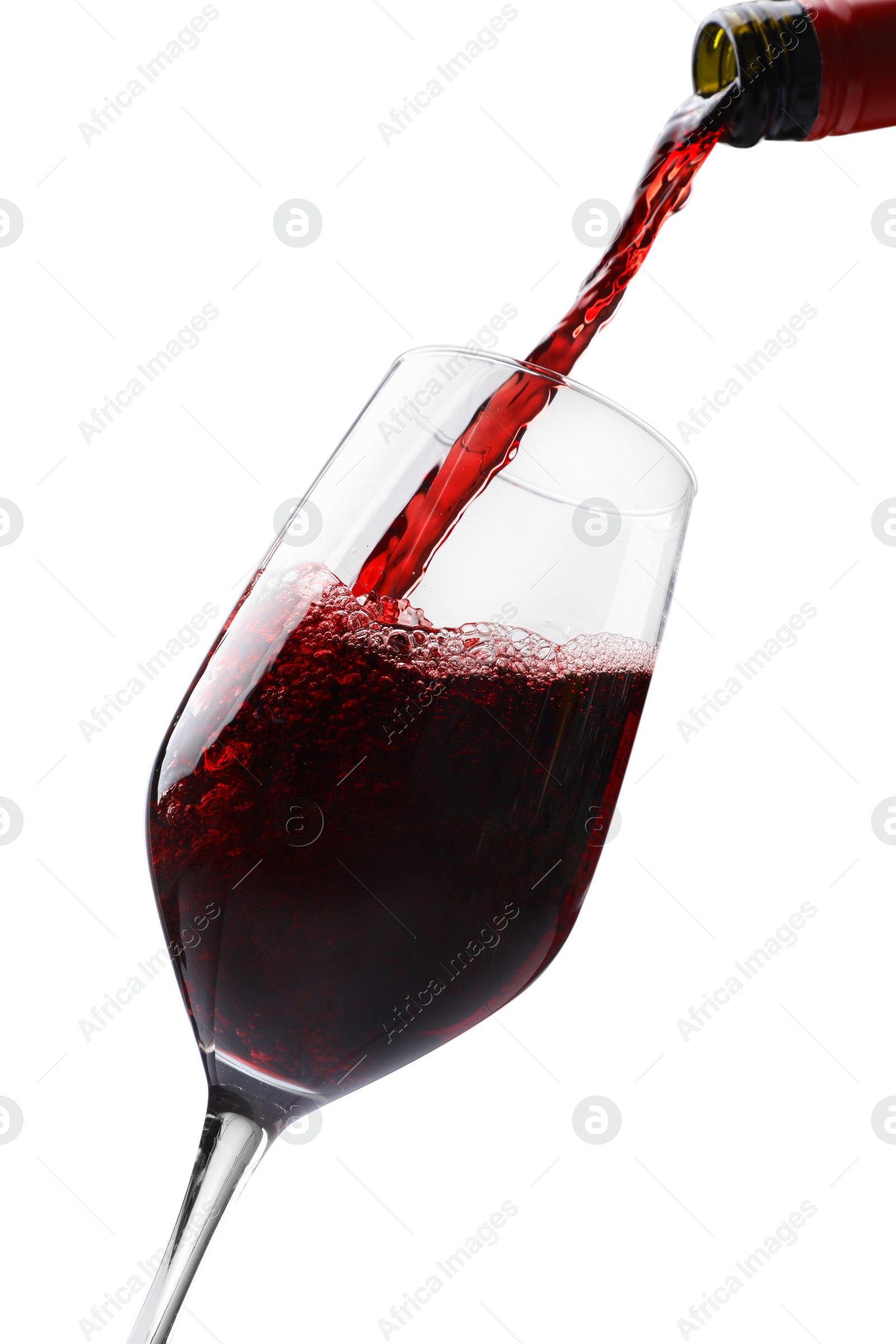 Photo of Pouring red wine into glass isolated on white