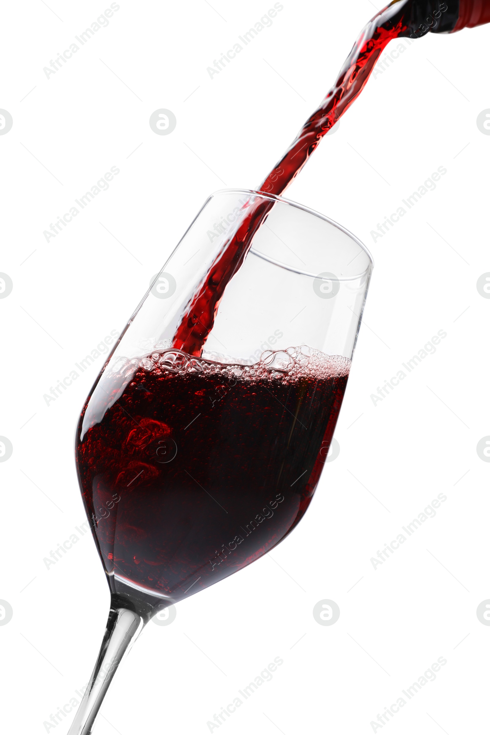 Photo of Pouring red wine into glass isolated on white