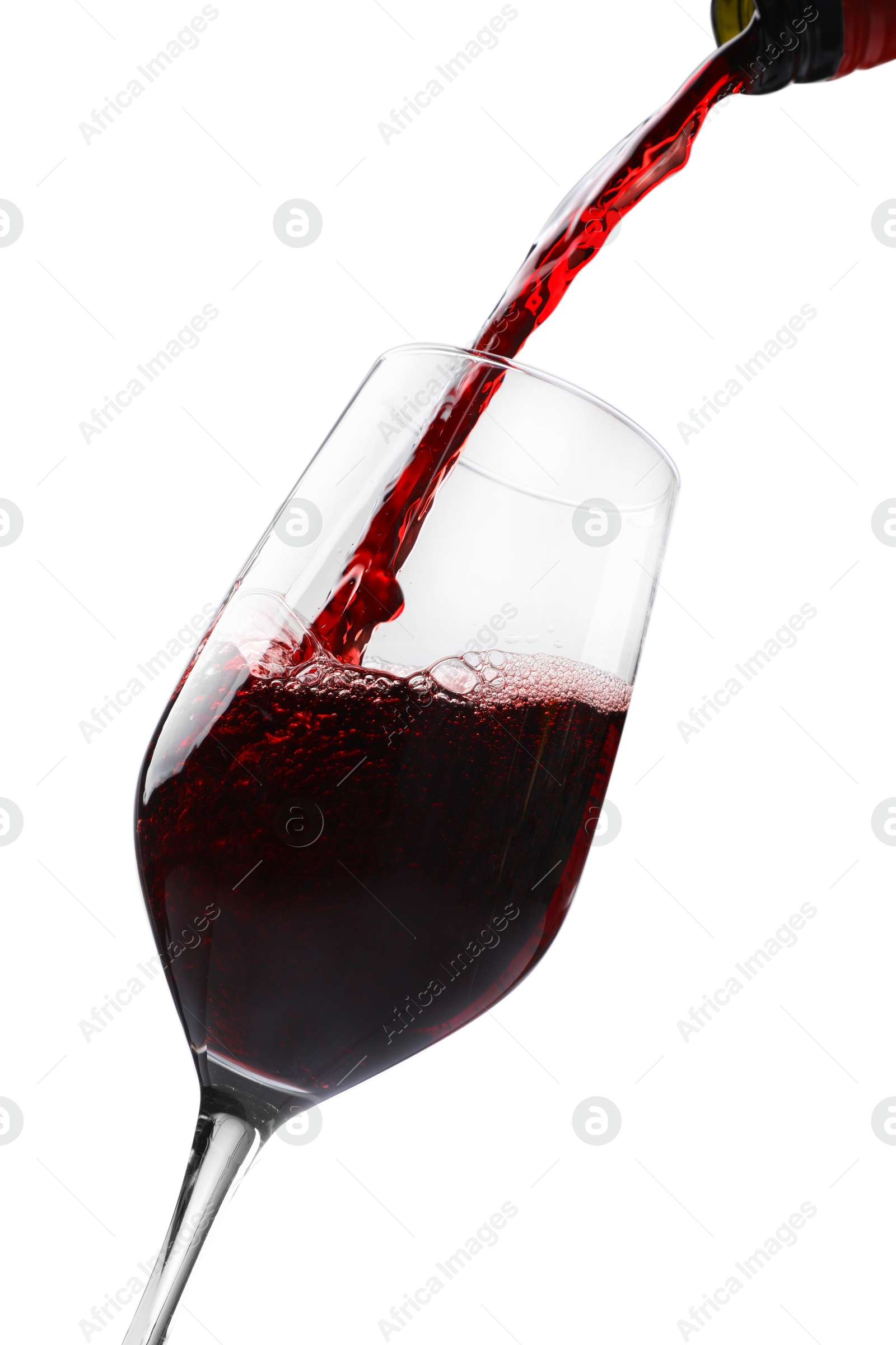 Photo of Pouring red wine into glass isolated on white