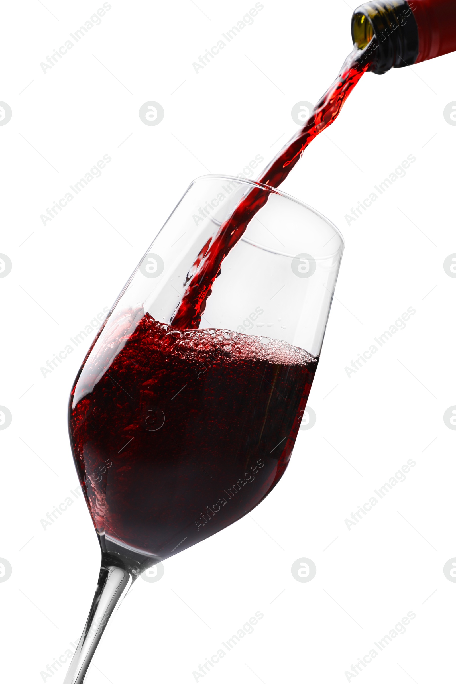 Photo of Pouring red wine into glass isolated on white