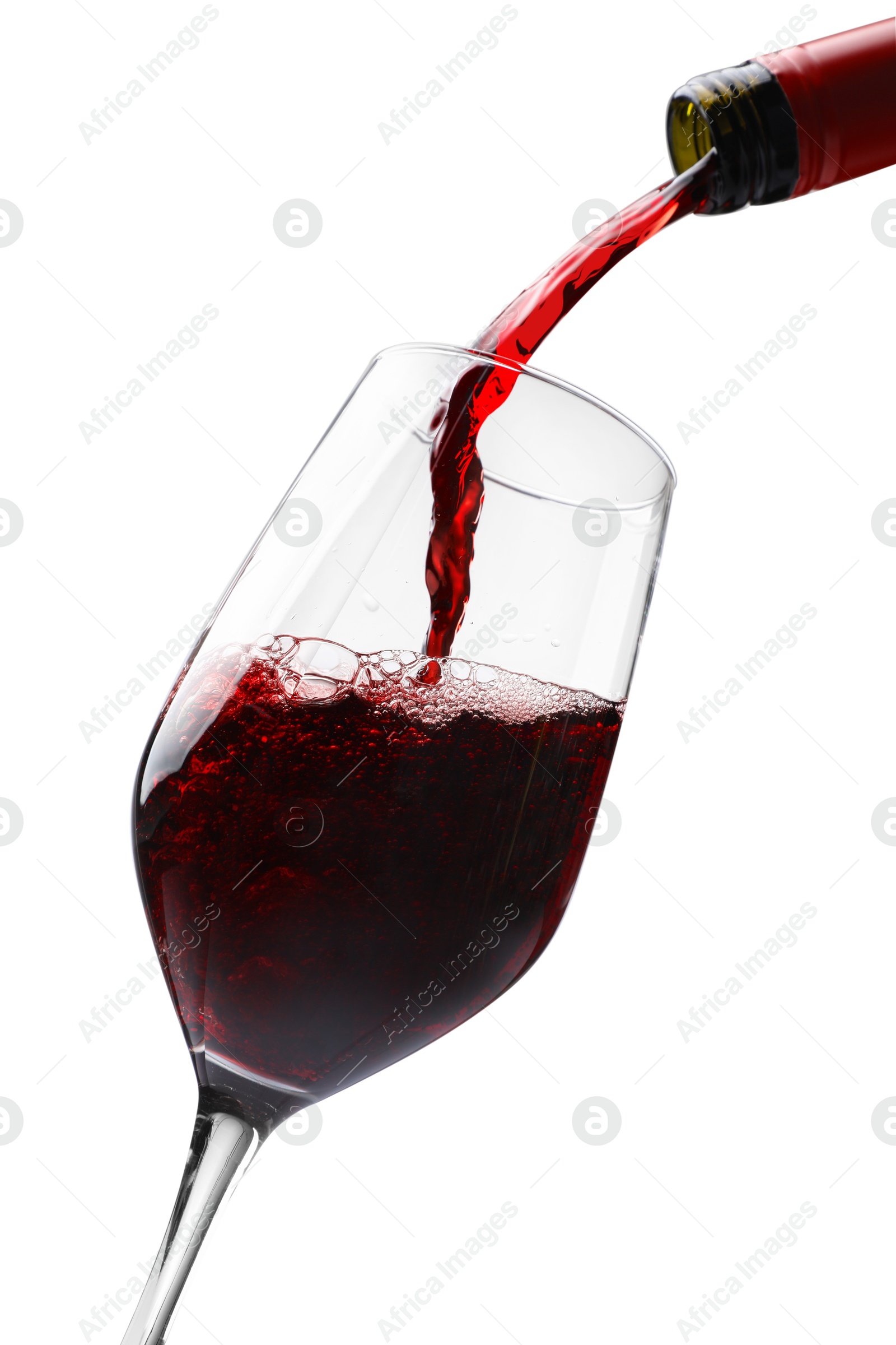 Photo of Pouring red wine into glass isolated on white