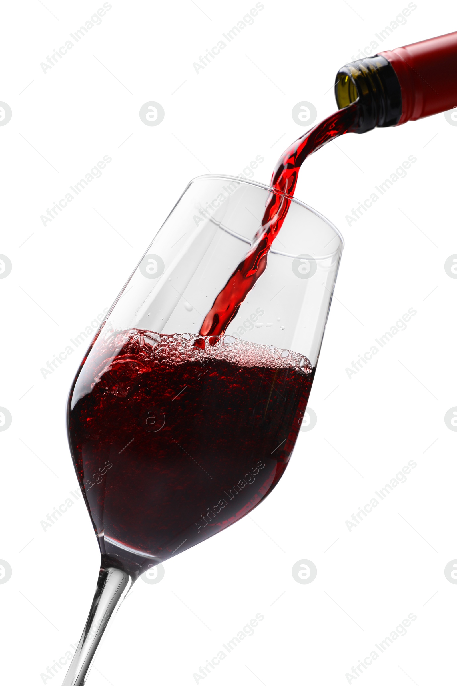 Photo of Pouring red wine into glass isolated on white