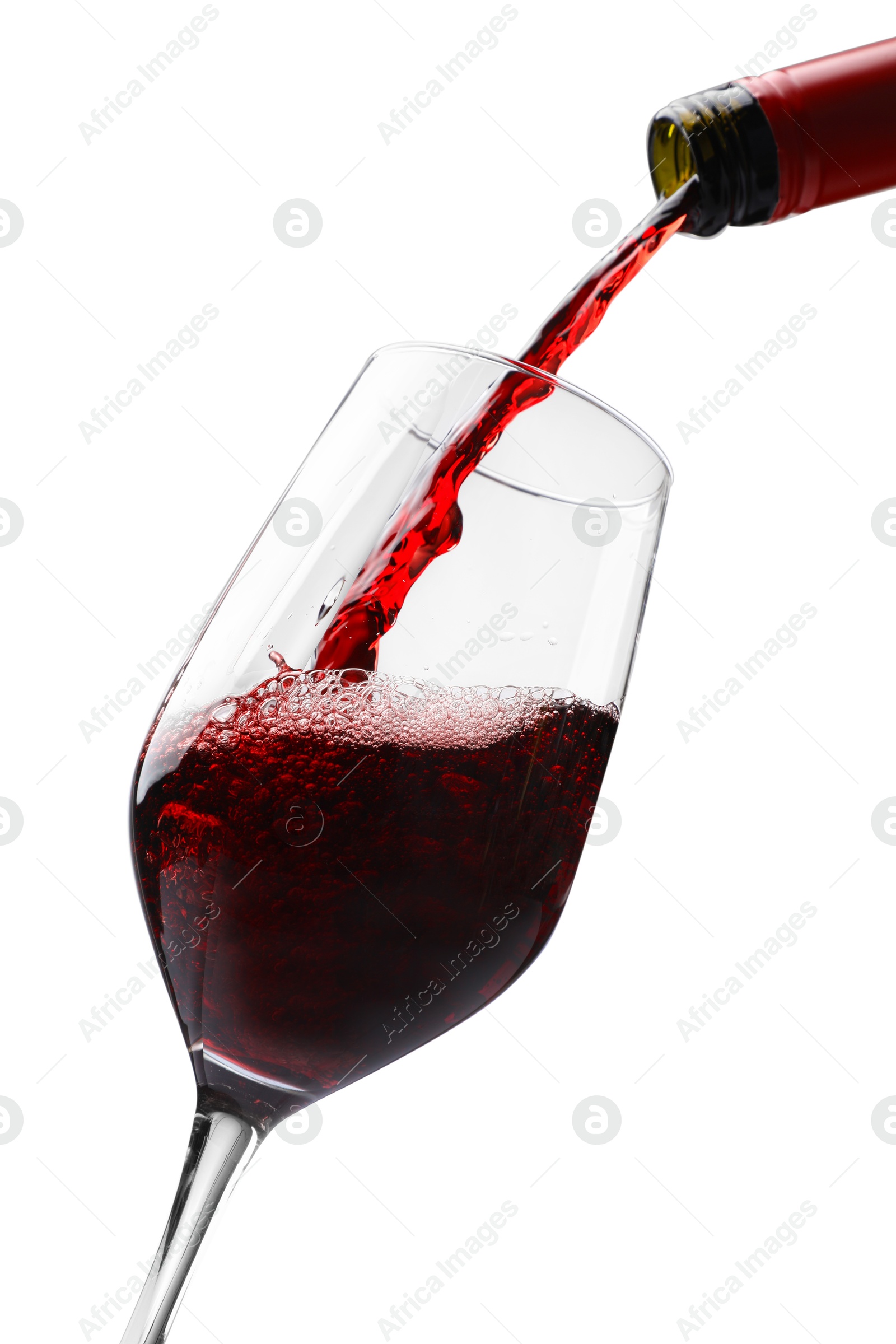 Photo of Pouring red wine into glass isolated on white