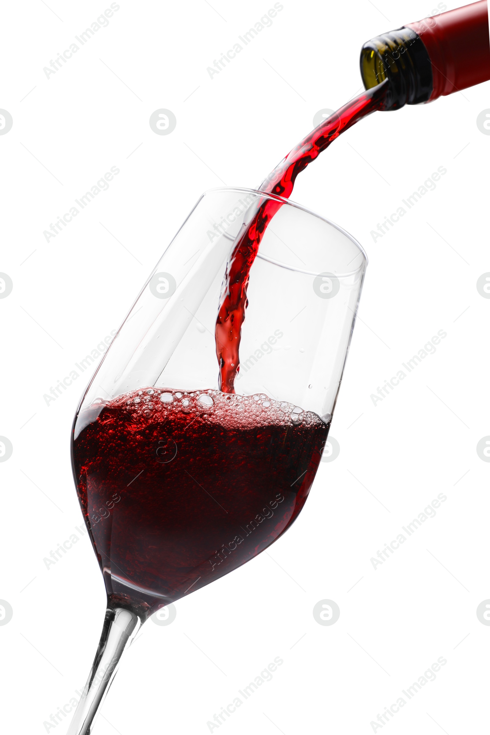 Photo of Pouring red wine into glass isolated on white