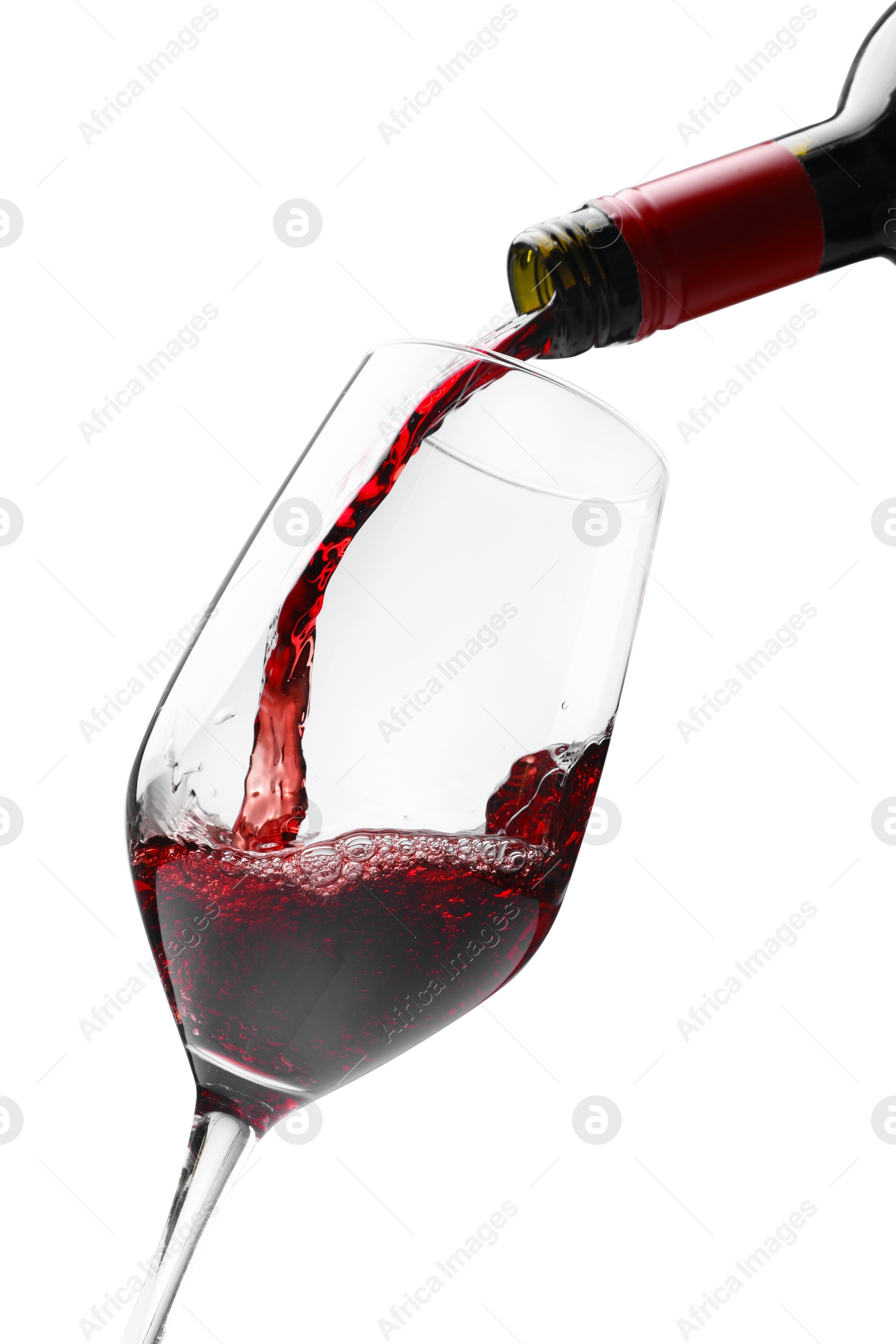 Photo of Pouring red wine into glass isolated on white