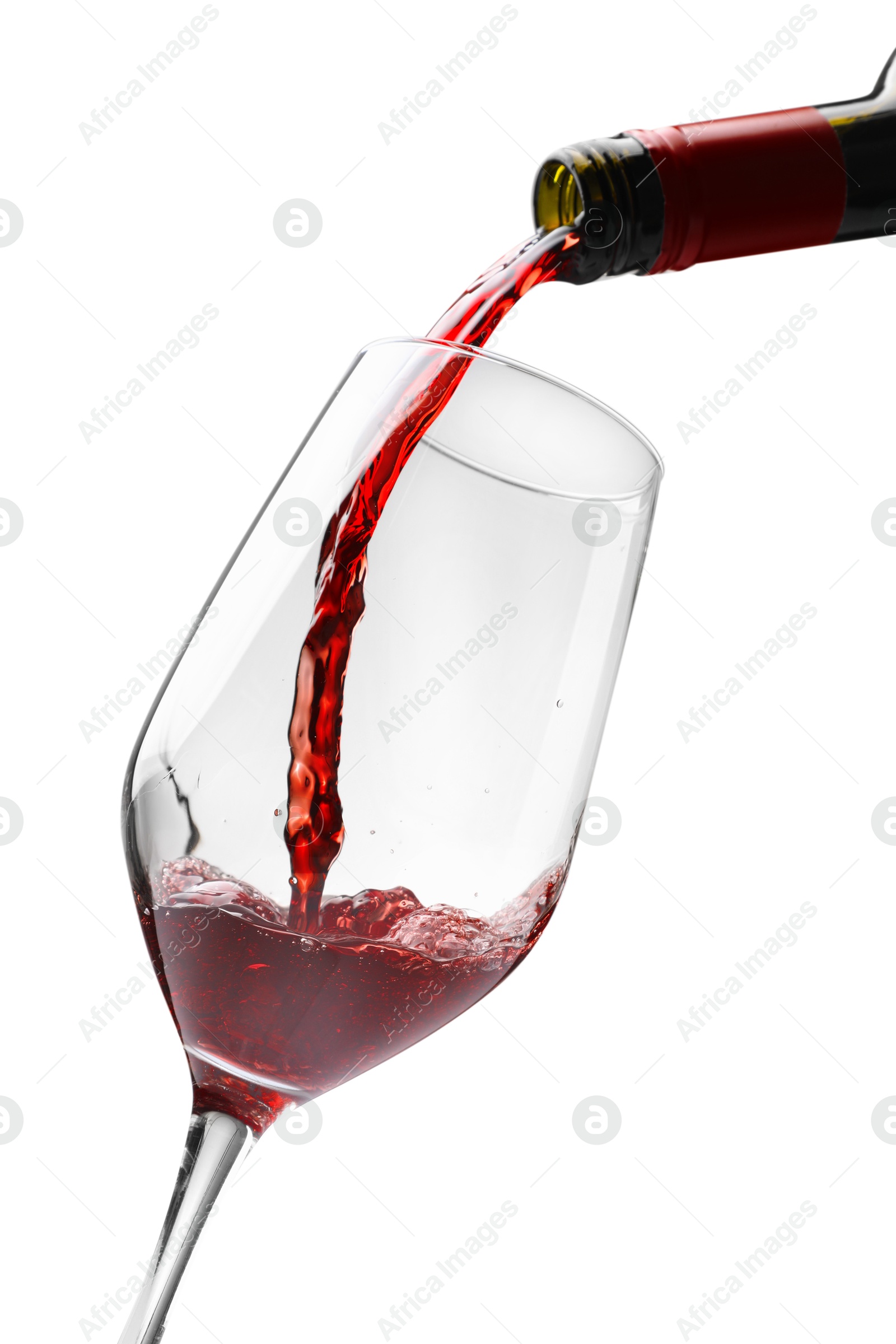 Photo of Pouring red wine into glass isolated on white