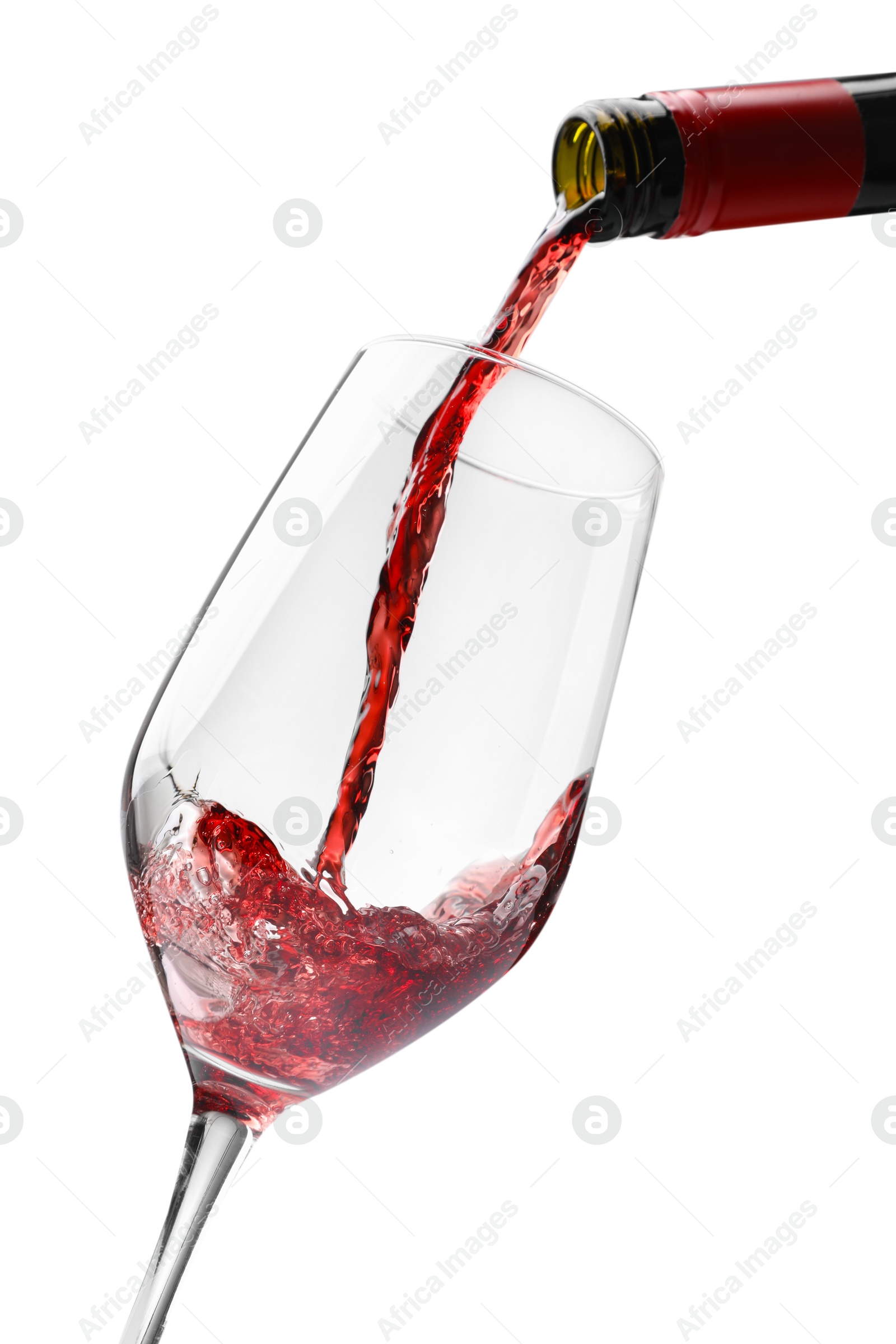 Photo of Pouring red wine into glass isolated on white