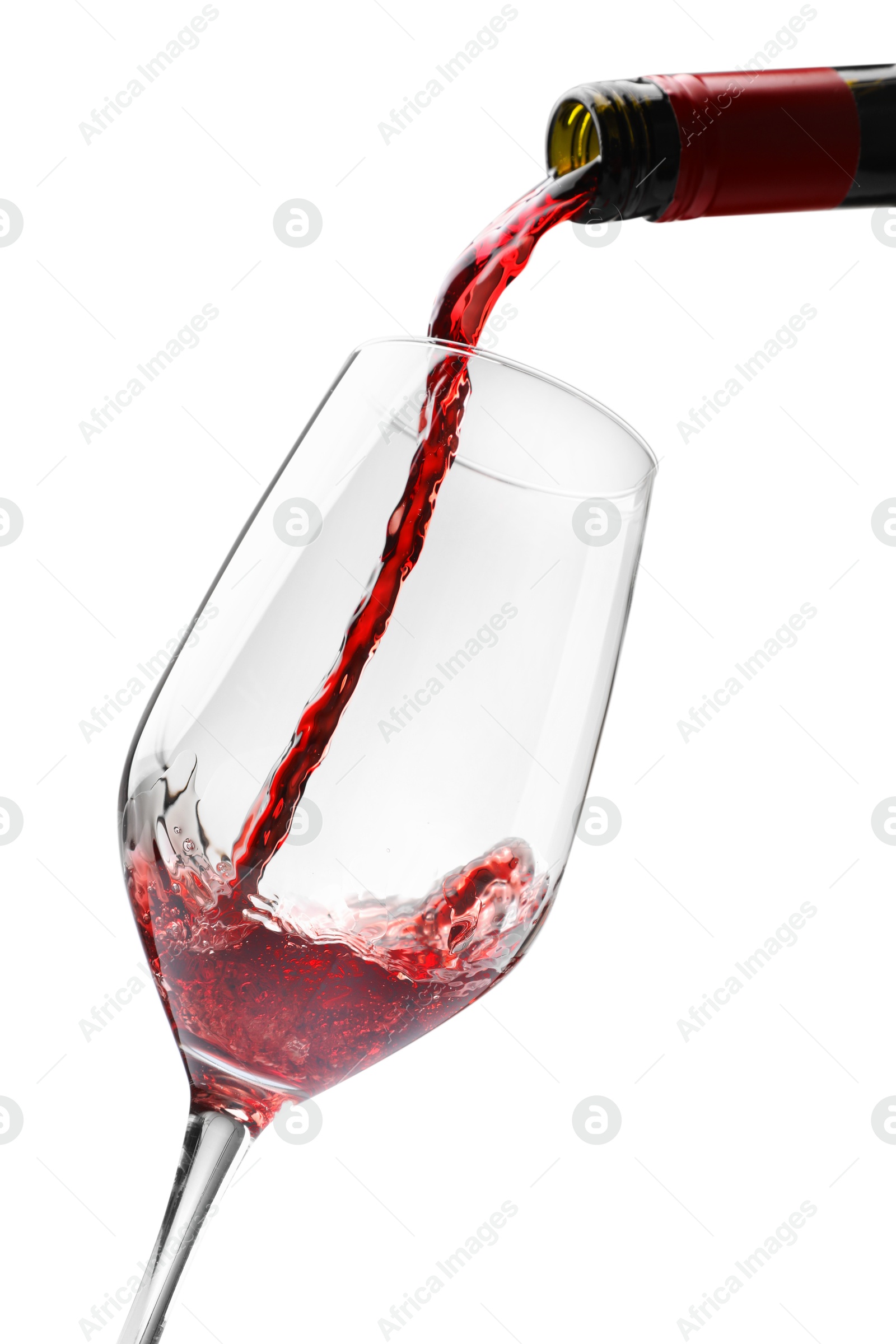 Photo of Pouring red wine into glass isolated on white