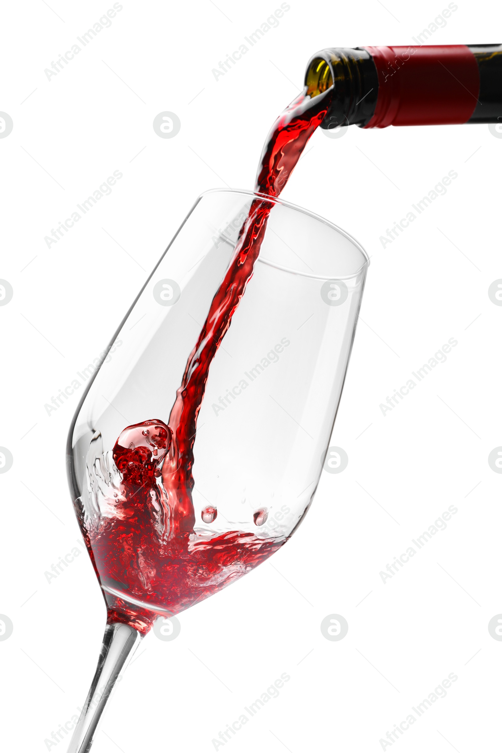 Photo of Pouring red wine into glass isolated on white