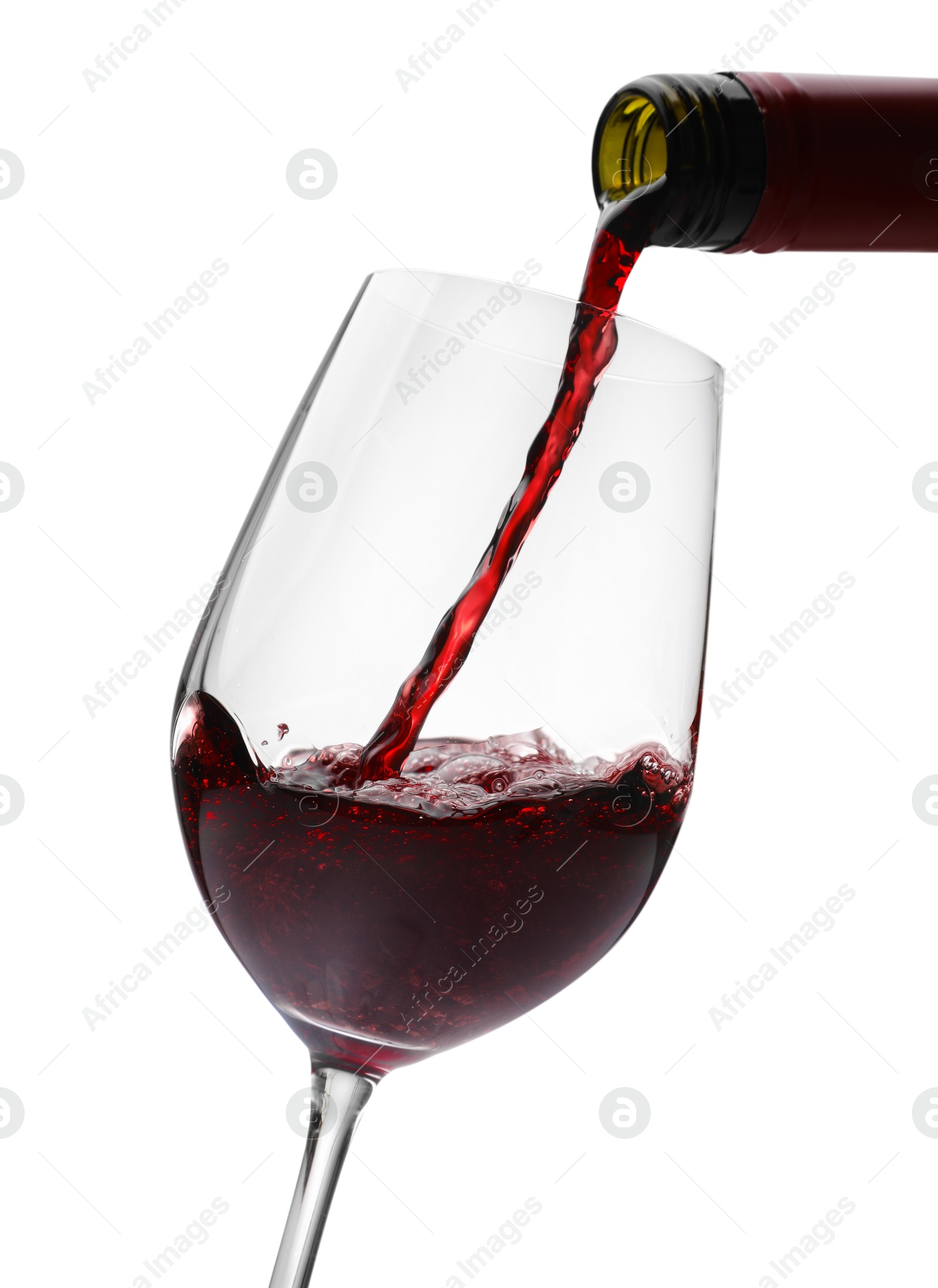 Photo of Pouring red wine into glass isolated on white