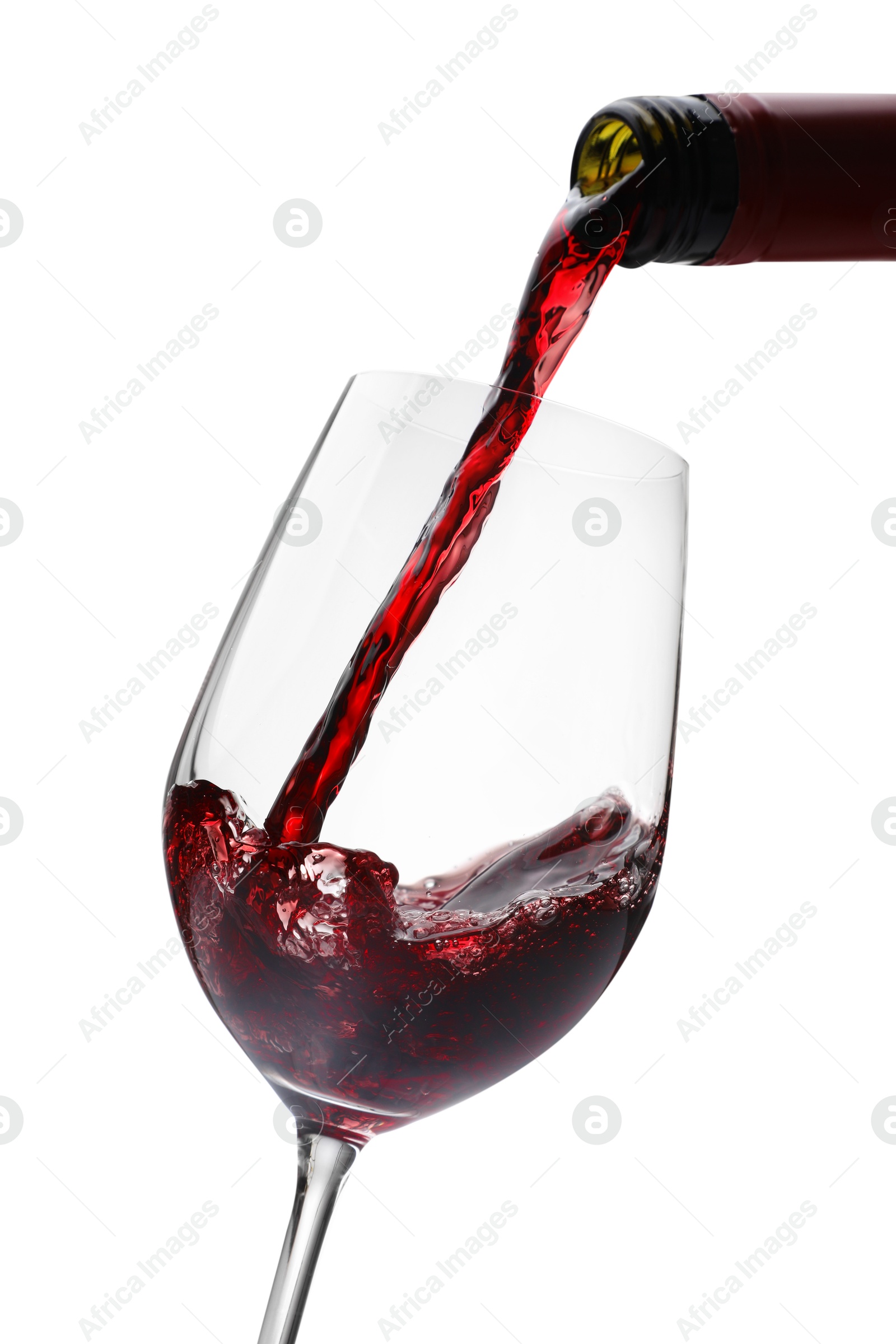 Photo of Pouring red wine into glass isolated on white