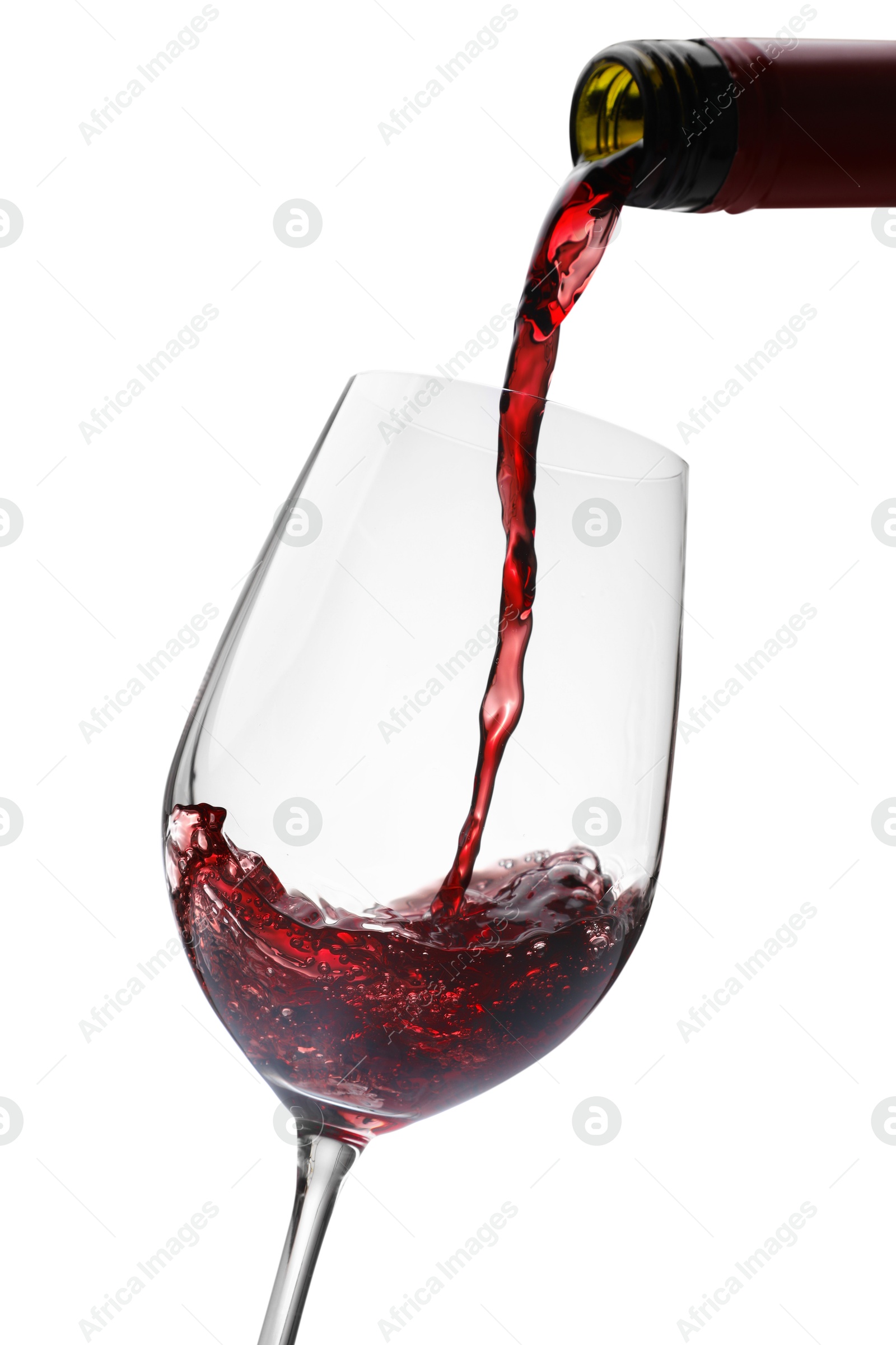 Photo of Pouring red wine into glass isolated on white