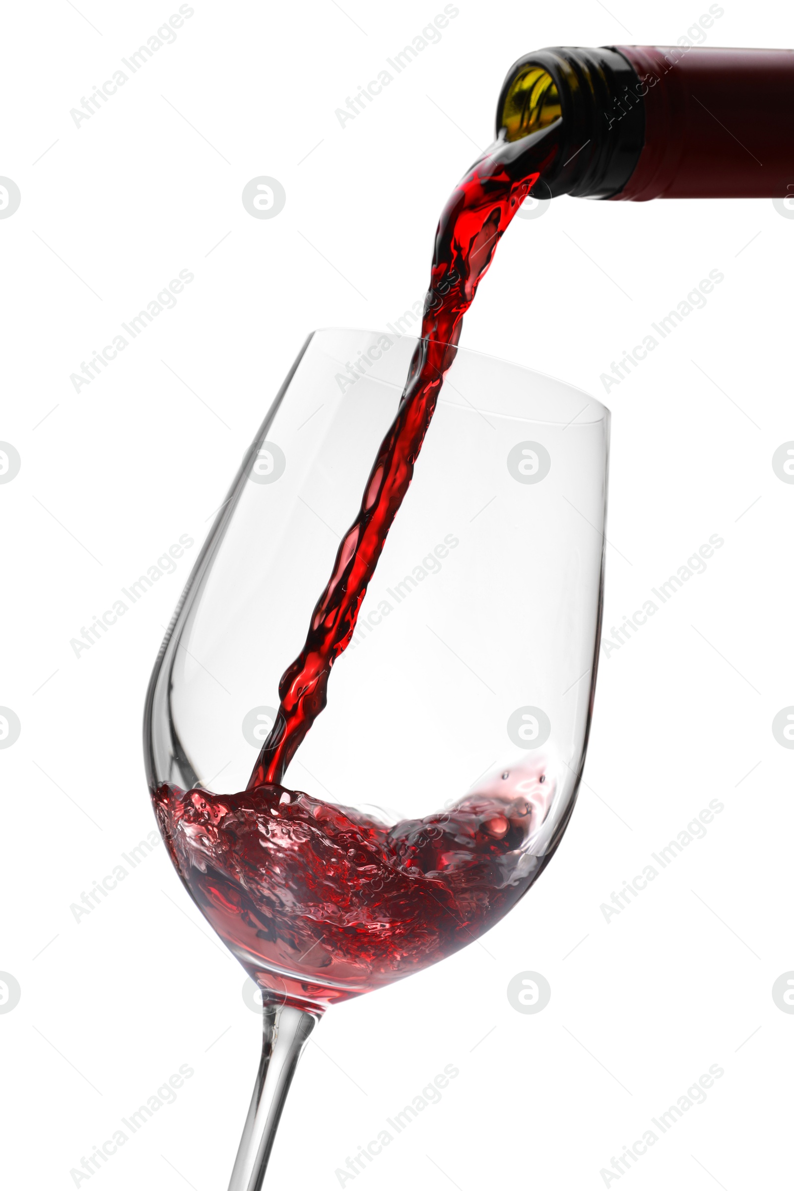 Photo of Pouring red wine into glass isolated on white