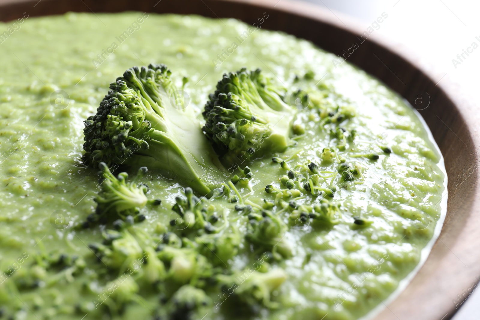 Photo of Delicious broccoli cream soup in bowl, closeup