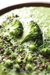 Photo of Delicious broccoli cream soup in bowl, closeup