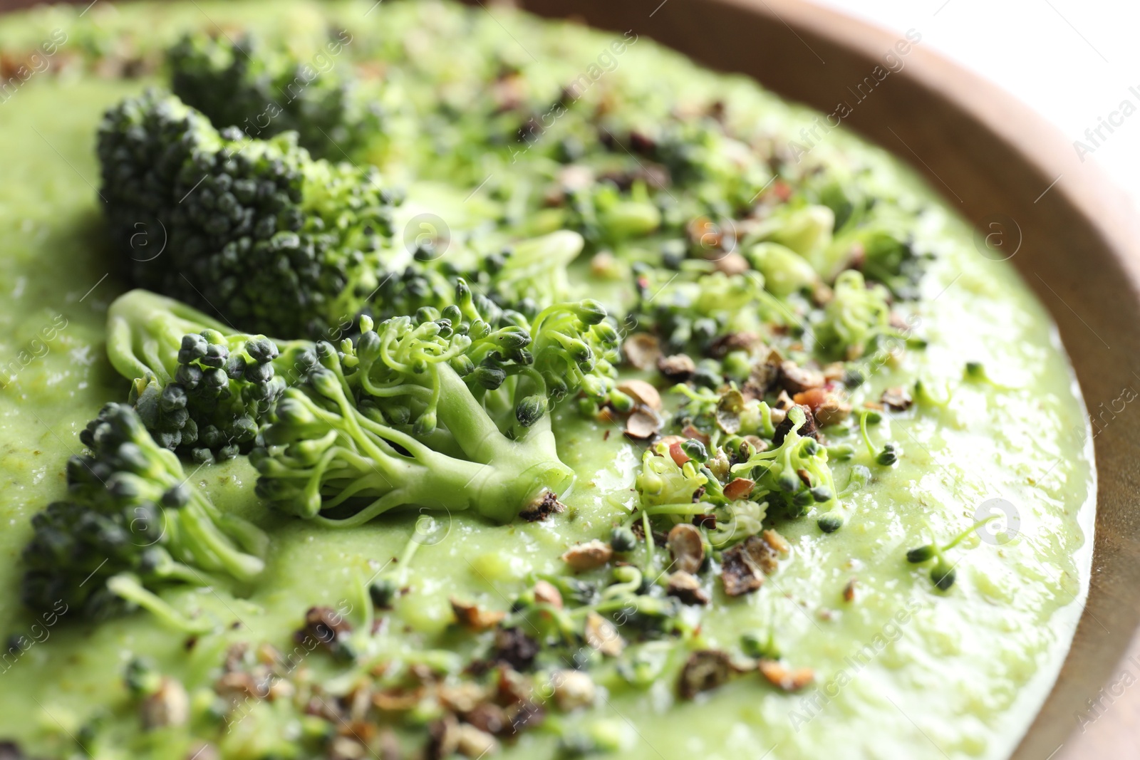 Photo of Delicious broccoli cream soup in bowl, closeup