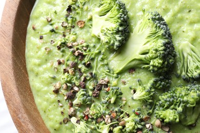 Photo of Delicious broccoli cream soup in bowl, closeup