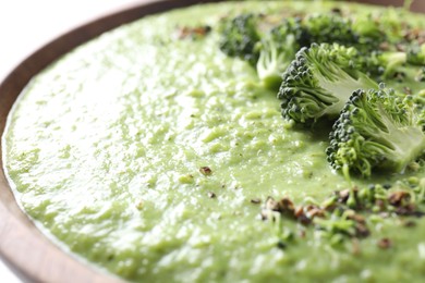 Photo of Delicious broccoli cream soup in bowl, closeup