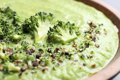 Photo of Delicious broccoli cream soup in bowl, closeup