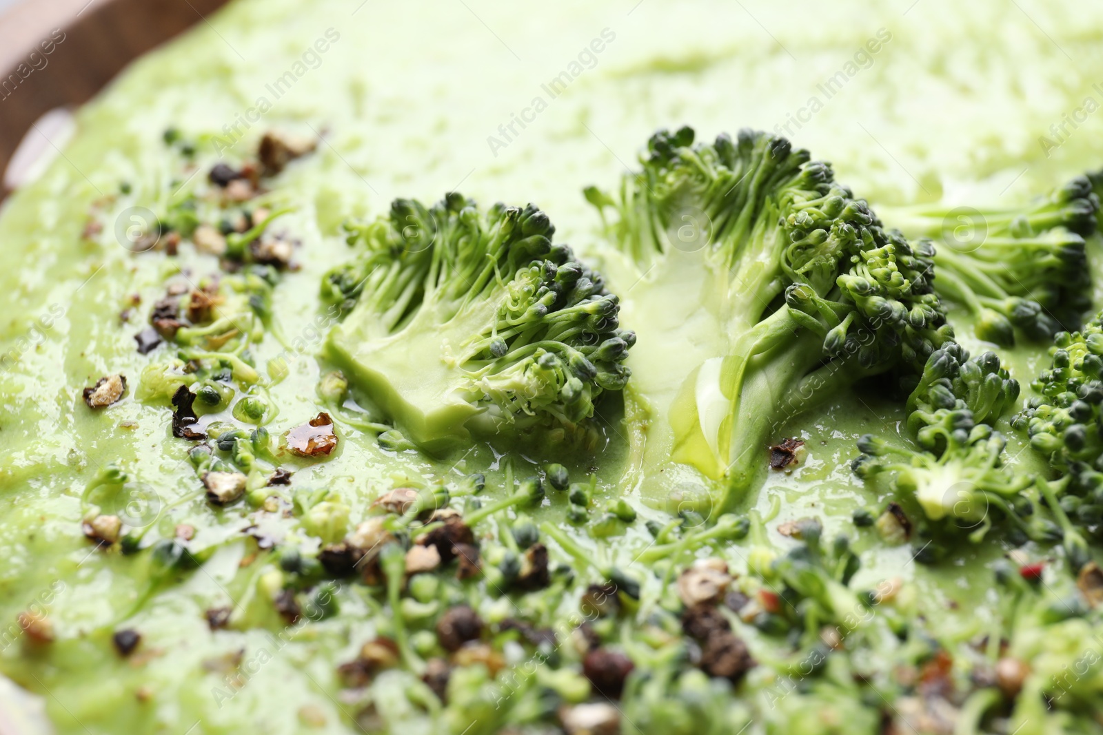 Photo of Delicious broccoli cream soup in bowl, closeup