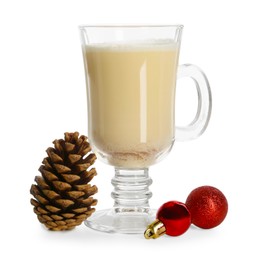 Photo of Tasty Christmas cocktail (eggnog) in glass, pine cone and baubles isolated on white