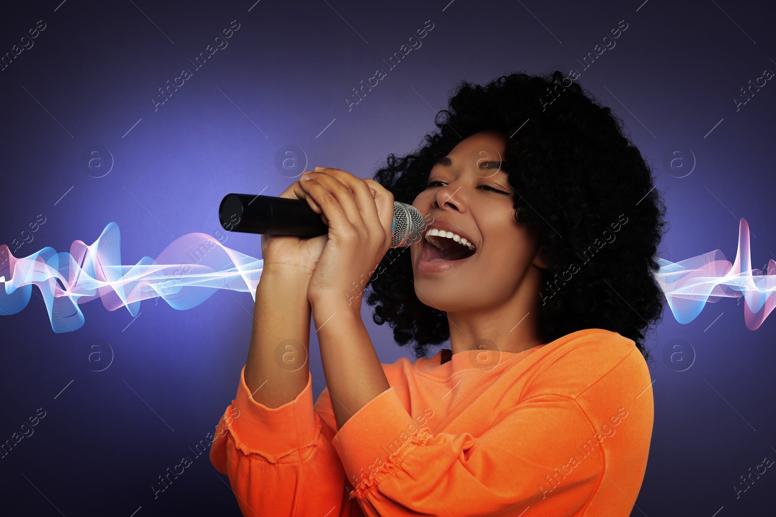 Image of Beautiful woman with microphone singing on color background. Sound waves