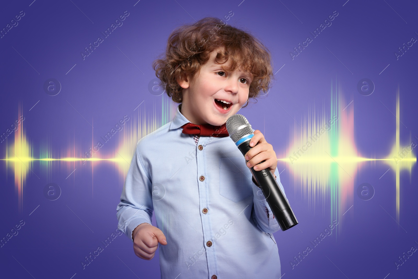 Image of Cute little boy with microphone singing on color background. Sound waves