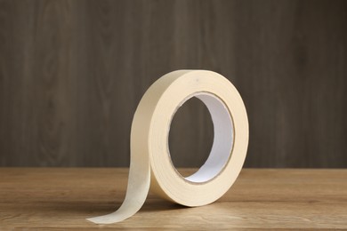 Roll of masking tape on wooden table