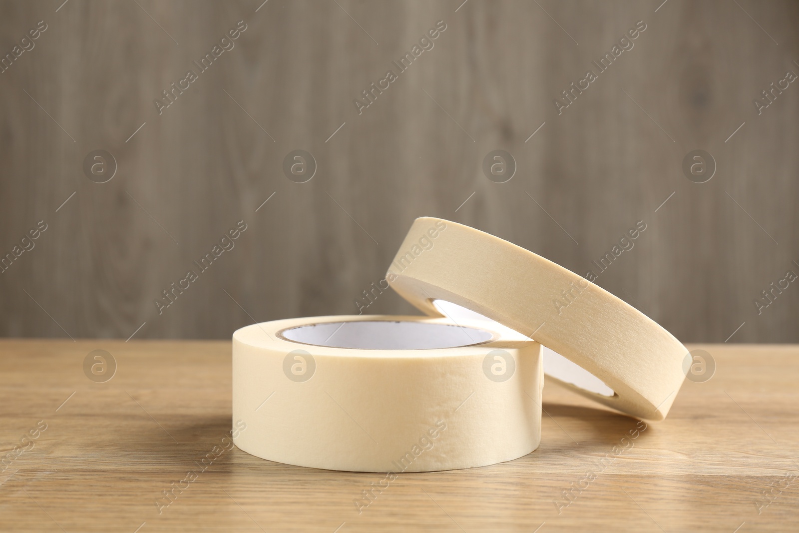 Photo of Rolls of masking tape on wooden table