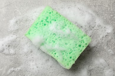 Photo of Sponge and foam on light grey table, top view