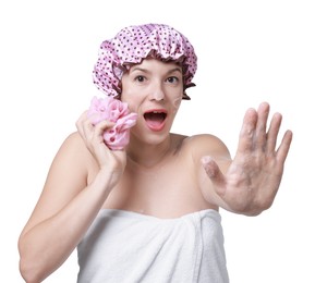 Photo of Woman with shower cap and mesh sponge making stop gesture on white background